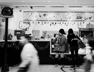 two woman buying in a hello kitty store thumbnail